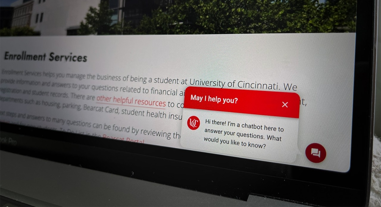 laptop screen with the UC Chatbot in the bottom right corner of the screen
